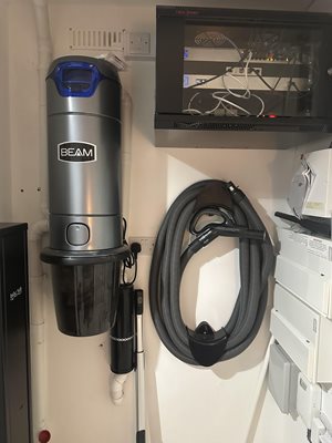 @countryhomeni-Beam-Central-Vacuum-Unit-and-Hose-in-Cupboard