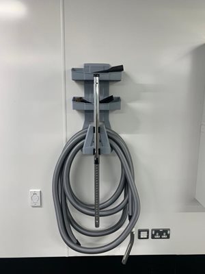 Beam Commercial Vacuum hose on wall hanger