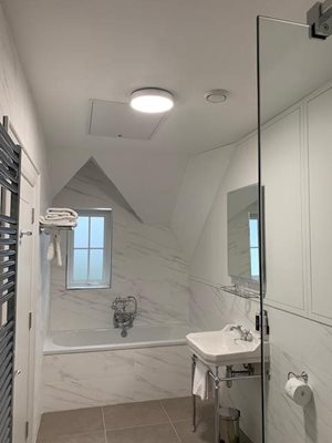 Marble-bathroom-with-Beam-extract-ventilation-valve-on-ceiling