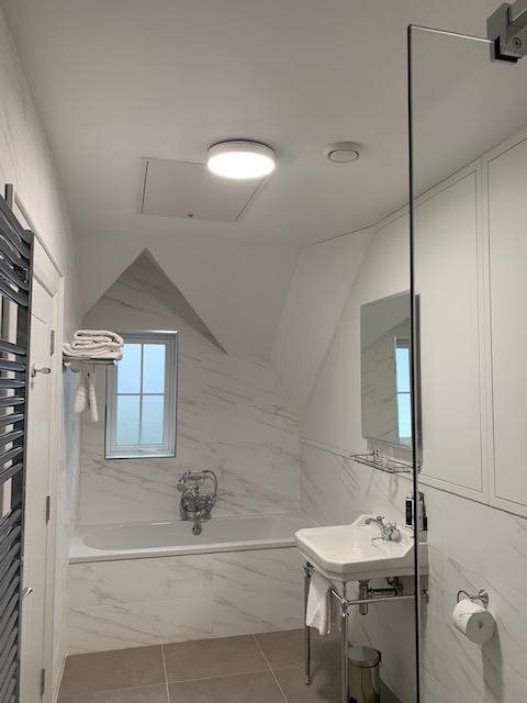 Marble bathroom with Beam extract ventilation valve on ceiling