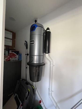 Beam Central Vacuum unit on wall in utility cupboard