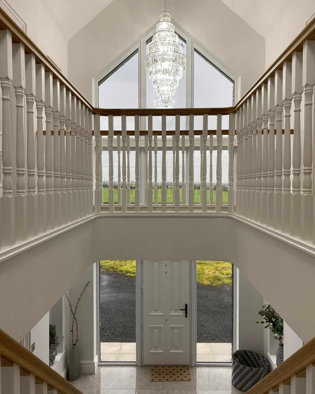 selfbuild north coast stairs and chandelier