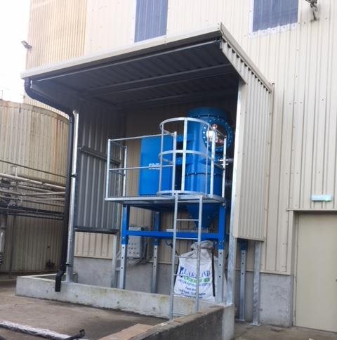 Beam industrial central vacuum collection bin outside factory
