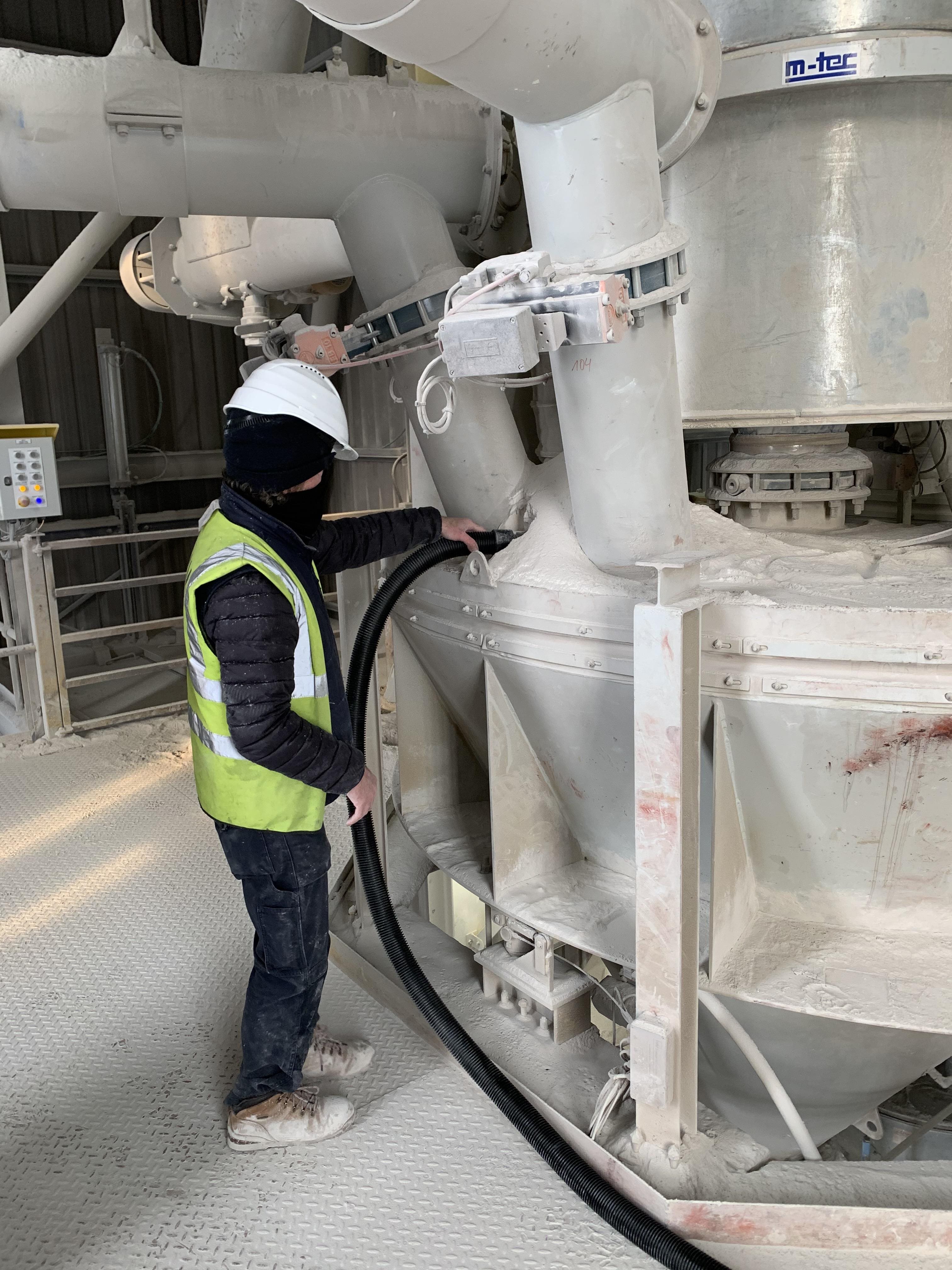 Beam Engineer vacuuming lime dust at Kilwaughter factory