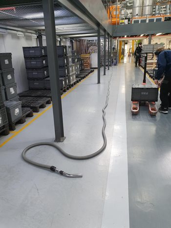 Beam Industrial Vacuum Hose on Factory Floor