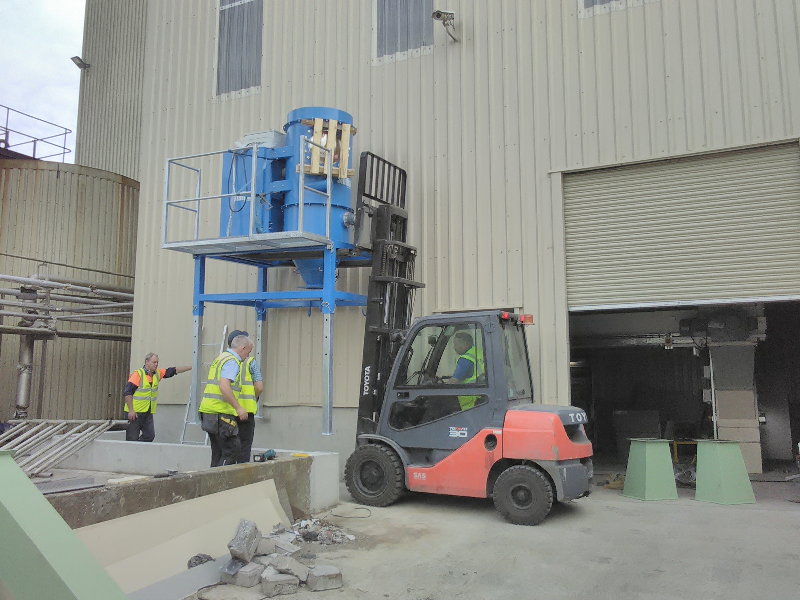 Beam industrial vacuum placed outside factory by forklift